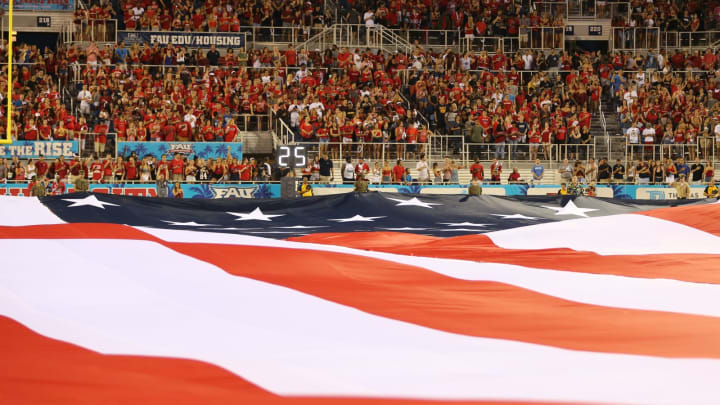 BOCA RATON, FL – SEPTEMBER 1: A giant American flag is unfurled prior to the game between the Florida Atlantic Owls and the Navy Midshipmen on September 1, 2017 at FAU Stadium in Boca Raton, Florida. (Photo by Joel Auerbach/Getty Images)