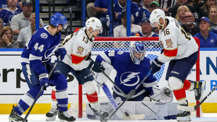 TAMPA, FL – MAY 23: Andrei Vasilevskiy #88 of the Tampa Bay Lightning makes a save against Sam Reinhart #13 and Aleksander Barkov #16 of the Florida Panthers as Jan Rutta #44 defends during the second period in Game Four of the Second Round of the 2022 Stanley Cup Playoffs at Amalie Arena on May 23, 2022 in Tampa, Florida. (Photo by Mike Carlson/Getty Images)