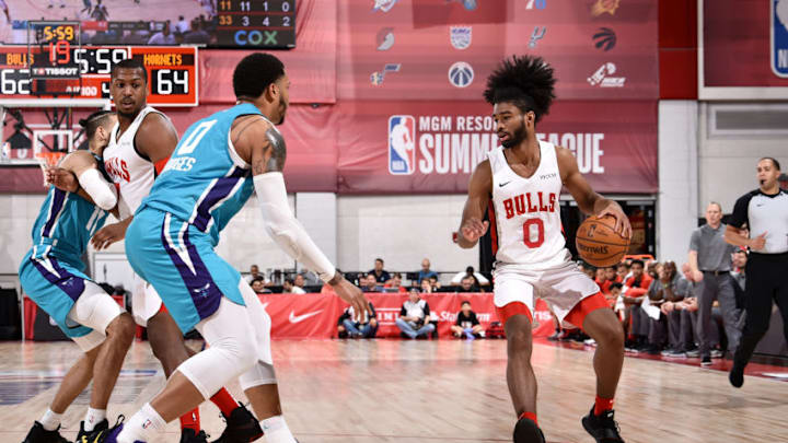 LAS VEGAS, NV - JULY 10: Coby White #0 of the Chicago Bulls handles the ball against the Charlotte Hornets on July 10, 2019 at the Cox Pavilion in Las Vegas, Nevada. NOTE TO USER: User expressly acknowledges and agrees that, by downloading and/or using this photograph, user is consenting to the terms and conditions of the Getty Images License Agreement. Mandatory Copyright Notice: Copyright 2019 NBAE (Photo by David Dow/NBAE via Getty Images)