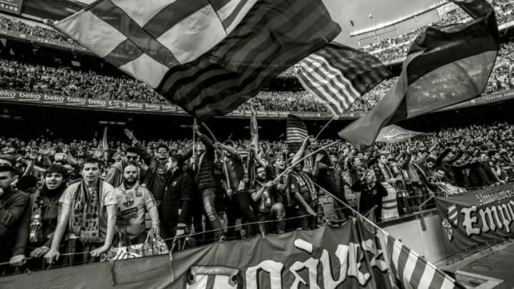 BARCELONA, SPAIN - DECEMBER 03: (EDITORS NOTE: This images has been converted to black and white) FC Barcelona fans cheers on their team prior to the La Liga match between FC Barcelona and Real Madrid CF at Camp Nou stadium on December 3, 2016 in Barcelona, Spain. (Photo by David Ramos/Getty Images)