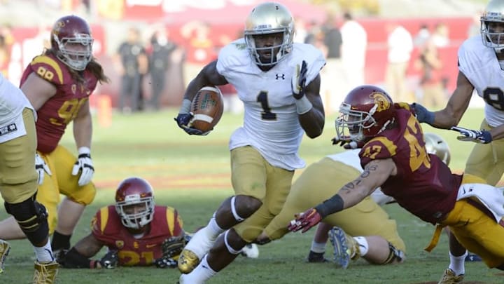 Nov 29, 2014; Los Angeles, CA, USA; Notre Dame Fighting Irish running back Greg Bryant (1) runs against the Southern California Trojans during the second half at Los Angeles Memorial Coliseum. Mandatory Credit: Richard Mackson-USA TODAY Sports