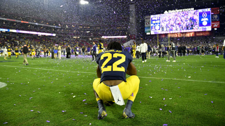 GLENDALE, ARIZONA – DECEMBER 31: Running back Tavierre Dunlap #22 of the Michigan Wolverines watches the TCU Horned Frogs confetti fall after the College Football Playoff Semifinal Fiesta Bowl football game at State Farm Stadium on December 31, 2022 in Glendale, Arizona. The TCU Horned Frogs won 51-45. (Photo by Alika Jenner/Getty Images)