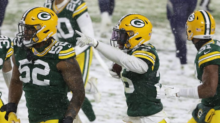 GREEN BAY, WISCONSIN - DECEMBER 27: Free safety Darnell Savage #26 of the Green Bay Packers celebrates an interception against the Tennessee Titans during the second quarter at Lambeau Field on December 27, 2020 in Green Bay, Wisconsin. (Photo by Dylan Buell/Getty Images)