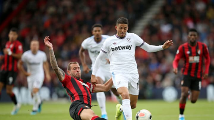 BOURNEMOUTH, ENGLAND - SEPTEMBER 28: Steve Cook of AFC Bournemouth tackles Pablo Fornals of West Ham United during the Premier League match between AFC Bournemouth and West Ham United at Vitality Stadium on September 28, 2019 in Bournemouth, United Kingdom. (Photo by Steve Bardens/Getty Images)