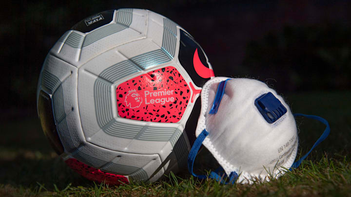 A Premier League Match Ball with a Protective Face Mask A Premier League Match Ball with a Protective Face Mask