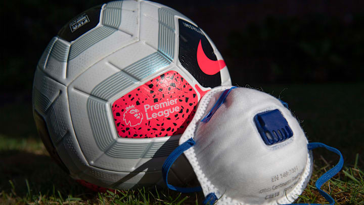 A Premier League Match Ball with a Protective Face Mask A Premier League Match Ball with a Protective Face Mask