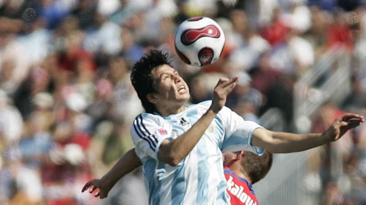 Argentina's Leonardo Sigali (front) head...