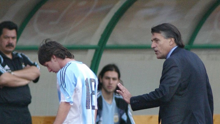 Argentine's Lionel Messi (C) is comforte