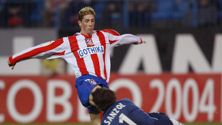 Atletico's Fernando Torres (top) is bloc