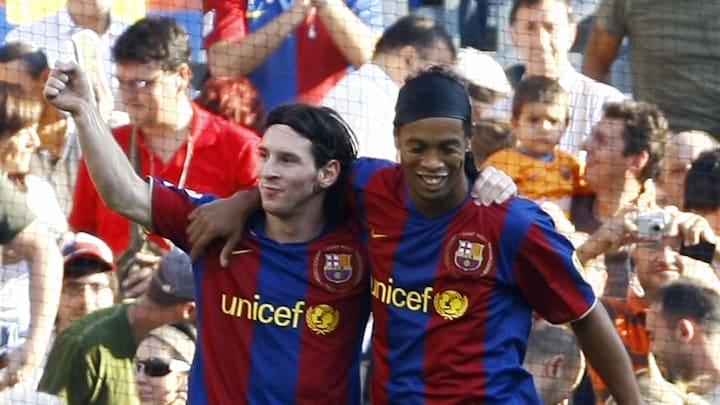 Barcelona's Argentinian Messi (L) is con Barcelona's Argentinian Messi (L) is con