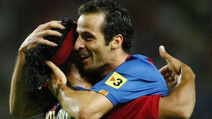 Barcelona's Ludocic Giuly (R) of France