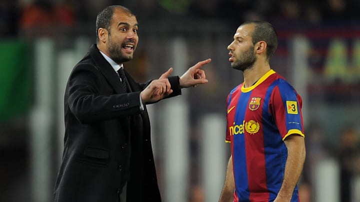 Barcelona's coach Pep Guardiola talks wi