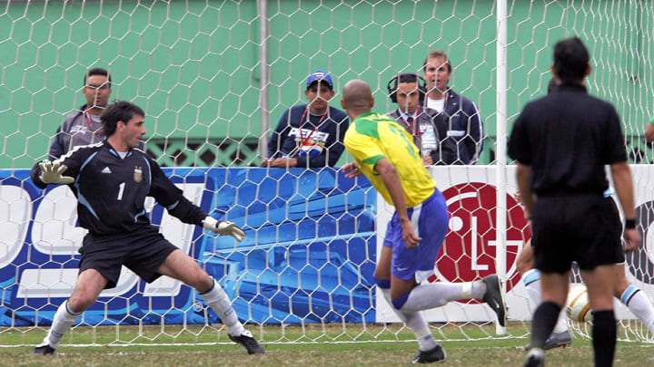 Brazilian Luisao (C) celebrates the firs Brazilian Luisao (C) celebrates the firs