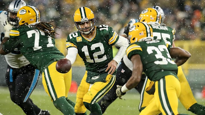 Packers quarterback Aaron Rodgers hands the ball off to Aaron Jones against the Carolina Panthers. Packers quarterback Aaron Rodgers hands the ball off to Aaron Jones against the Carolina Panthers.