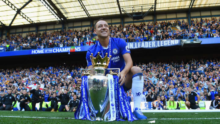 Terry with the Premier League trophy at Stamford Bridge in 2017.