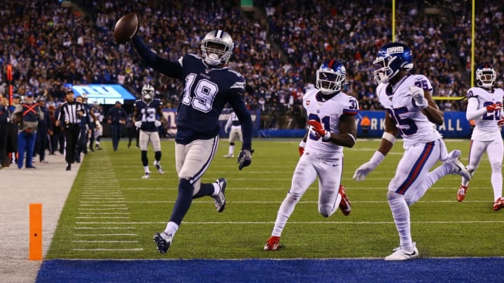 Amari Cooper, left, prances into the end zone for a touchdown against the New York Giants.