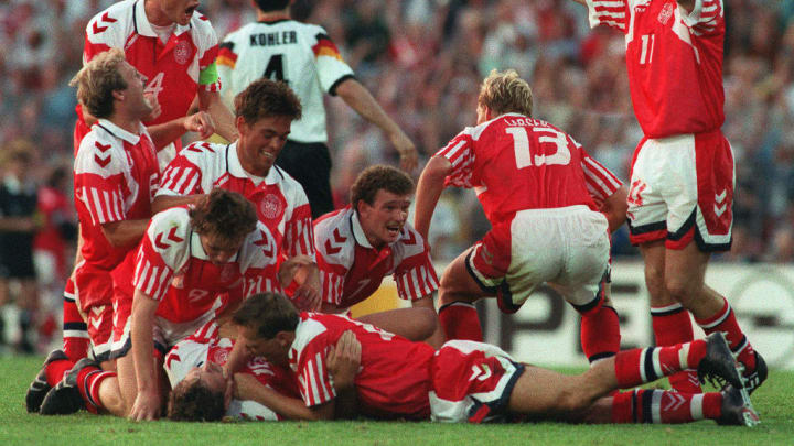 Danish players celebrate their victory after defea