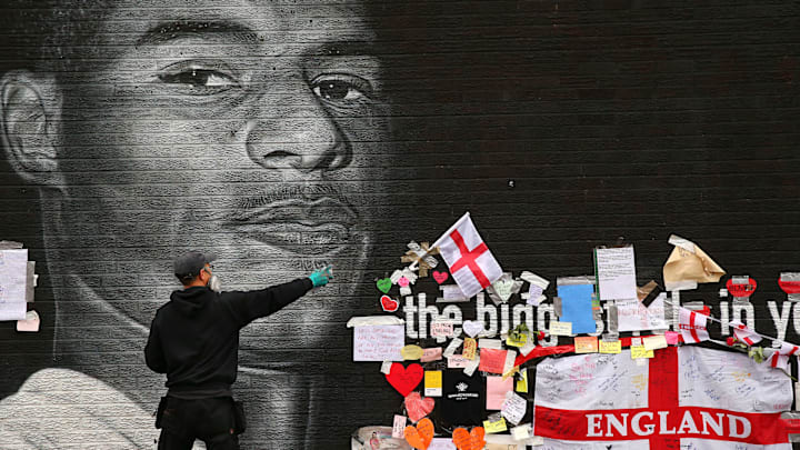 Defaced Mural Of Marcus Rashford Repaired By The Artist In Manchester Defaced Mural Of Marcus Rashford Repaired By The Artist In Manchester