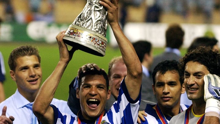 Derlei of FC Porto celebrates with the trophy