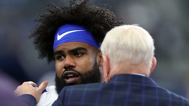 Cowboys running back Ezekiel Elliot, left, talks with owner and GM Jerry Jones before a game against the Lions. Cowboys running back Ezekiel Elliot, left, talks with owner and GM Jerry Jones before a game against the Lions.