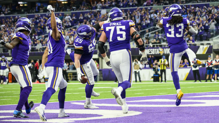 The Vikings celebrate a touchdown in a game against the Detroit Lions.