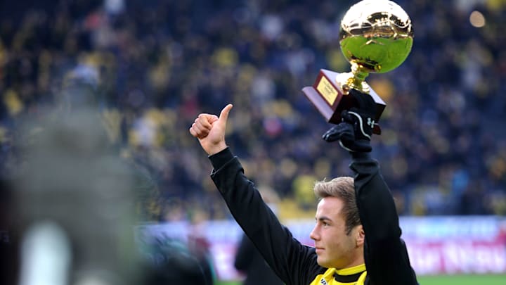 Dortmund's midfielder Mario Goetze holds