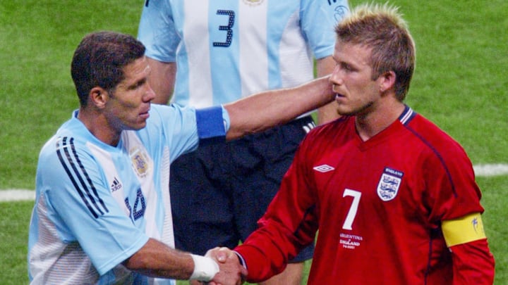 English captain and midfielder David Beckham (R) s