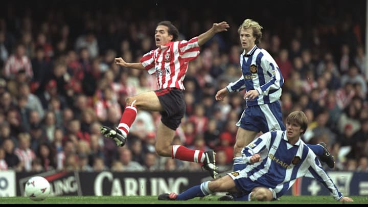 Eyal Berkovic of Southampton leaps over the tackle of David Beckham of Manchester United whilst Jori Eyal Berkovic of Southampton leaps over the tackle of David Beckham of Manchester United whilst Jori