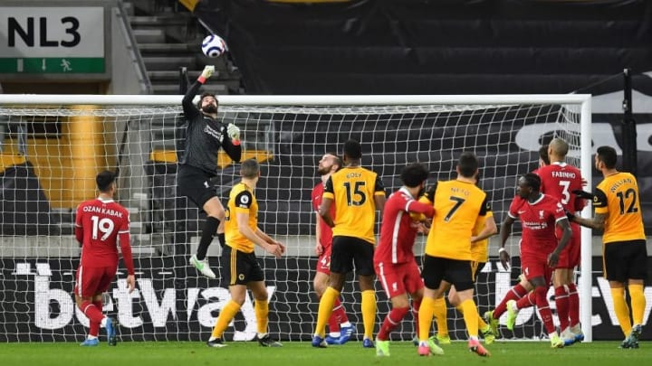 Liverpool keeper Alisson punches clear against Wolves