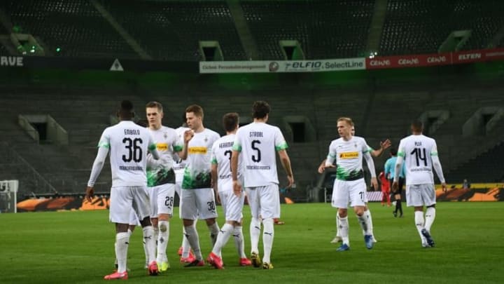 Borussia Mönchengladbach players celebrating a goal against 1.FC Köln.