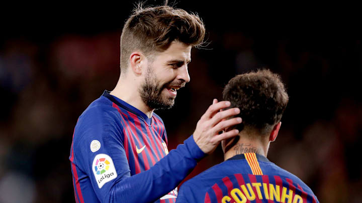 Piqué celebra un gol con Coutinho Piqué celebra un gol con Coutinho