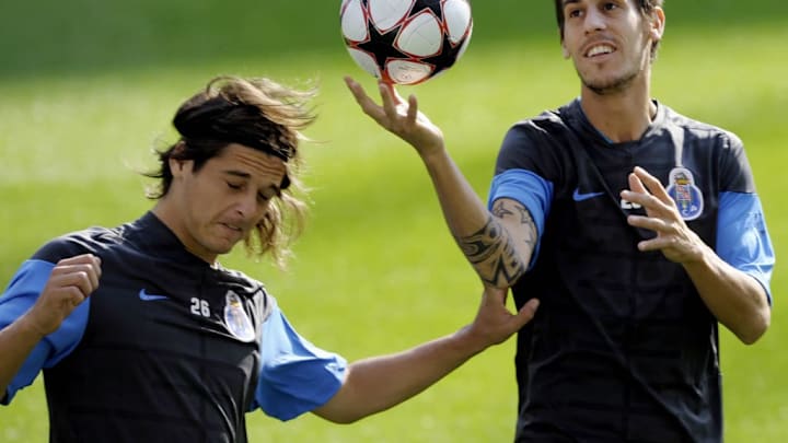 FC Porto players Sebastian Prediger (L)