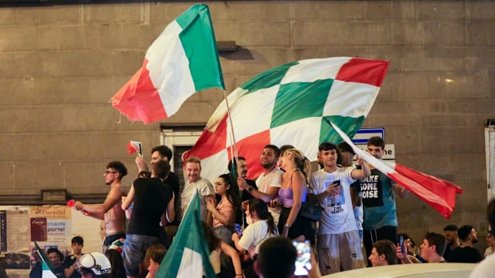 Fans of the Italian national football team celebrate victory...