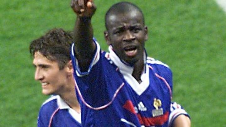 French Lilian Thuram (R) celebrates with