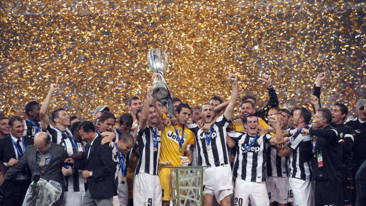 Juventus players celebrate with the trop