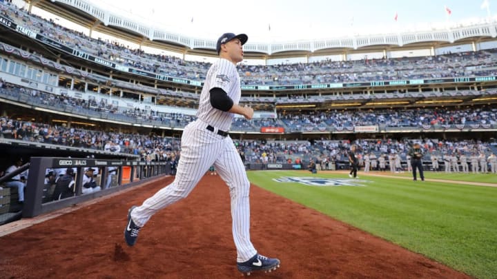 Giancarlo Stanton warms up for Game 3 of the ALCS. 