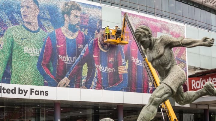Lionel Messi's photo seen being removed from a poster at the...