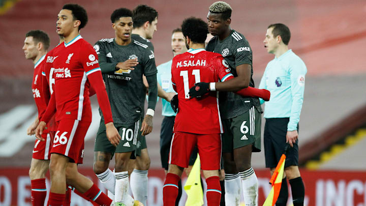 Liverpool and Manchester United players after playing out a 0-0 draw at Anfield Liverpool and Manchester United players after playing out a 0-0 draw at Anfield