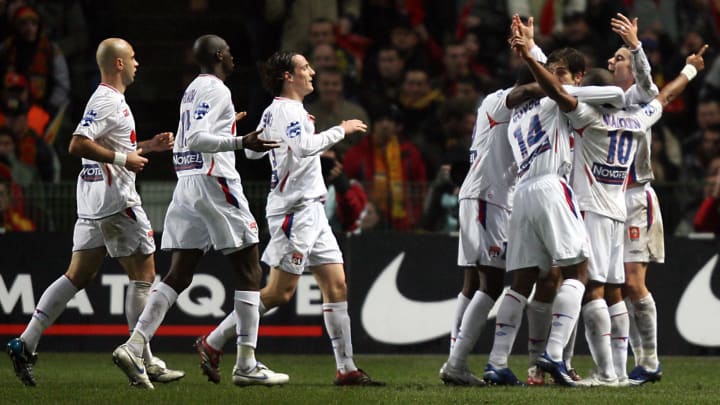 Lyon's players jubilate after their team