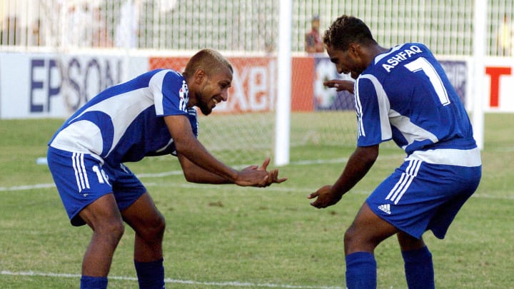 Maldives soccer players Umar Ali (L) and