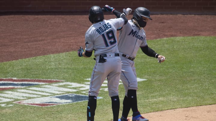 Members of the Miami Marlins celebrate during one of their three games this season. Members of the Miami Marlins celebrate during one of their three games this season.