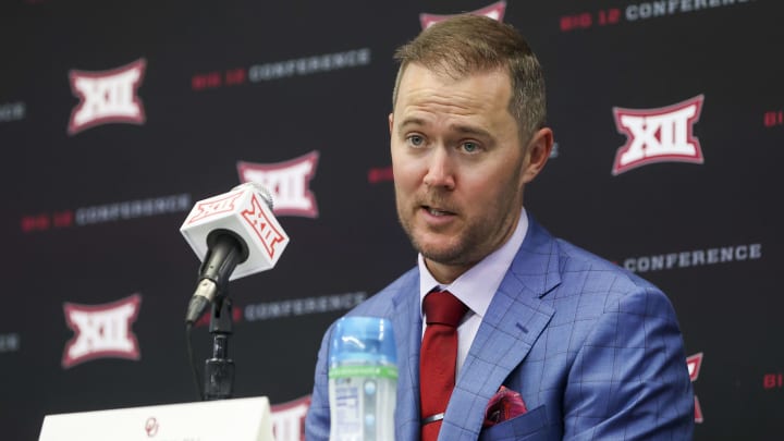Could the Big XII background behind OU coach Lincoln Riley be substituted for an SEC banner in a few years?