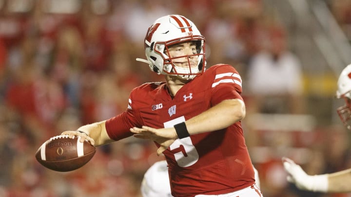 Graham Mertz and the Wisconsin Badgers are 6.5-point favorites against the undefeated Notre Dame Fighting Irish this week at Soldier Field in Chicago.