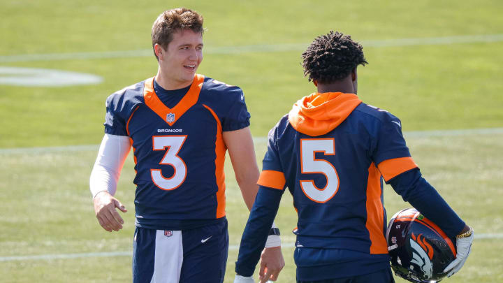 Denver Broncos quarterback Drew Lock chats during practice with starting QB Teddy Bridgewater.