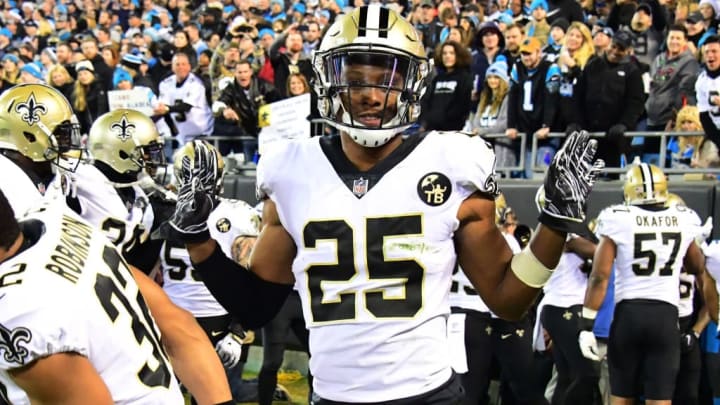Saints cornerback Eli Apple celebrates with teammates in the end zone after beating the Carolina Panthers.