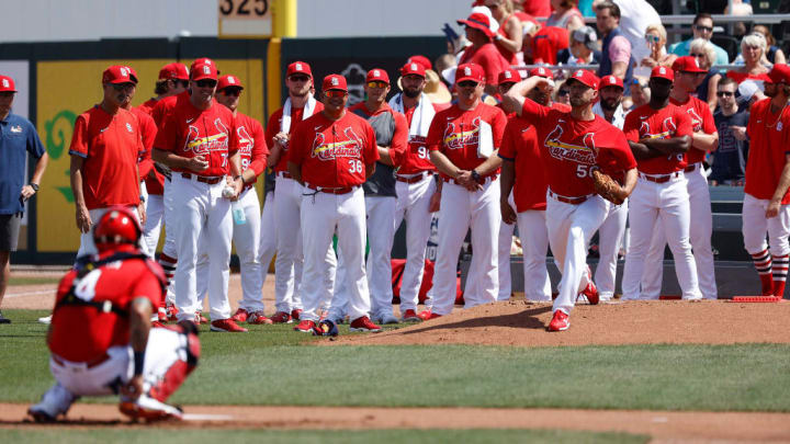 The Cardinals pitching staff watches Adam Wainwright warm up before his first Spring Training start.