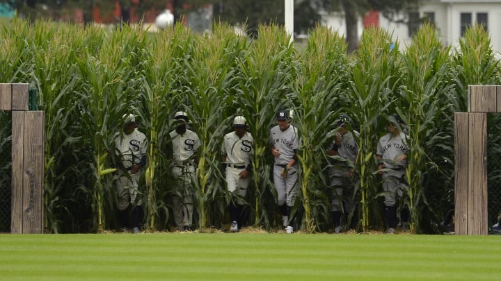 Yankees and White Sox emerge from the field of corn onto the Field of Dreams.