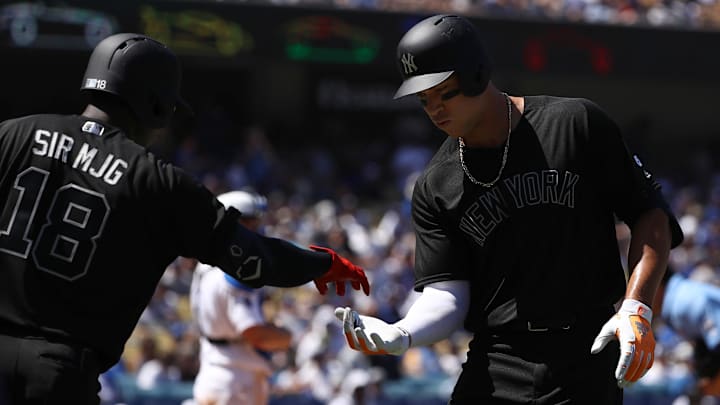 LOS ANGELES, CALIFORNIA - AUGUST 24: Aaron Judge #99 of the New York Yankees celebrates with teammate Didi Gregorius #18 after Judge hit a solo home run during the fourth inning of the MLB game against the Los Angeles Dodgers at Dodger Stadium on August 24, 2019 in Los Angeles, California. Teams are wearing special color-schemed uniforms with players choosing nicknames to display for Players' Weekend. (Photo by Victor Decolongon/Getty Images) LOS ANGELES, CALIFORNIA - AUGUST 24: Aaron Judge #99 of the New York Yankees celebrates with teammate Didi Gregorius #18 after Judge hit a solo home run during the fourth inning of the MLB game against the Los Angeles Dodgers at Dodger Stadium on August 24, 2019 in Los Angeles, California. Teams are wearing special color-schemed uniforms with players choosing nicknames to display for Players' Weekend. (Photo by Victor Decolongon/Getty Images)