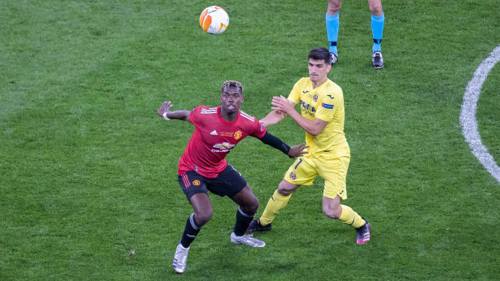 Paul Pogba of Manchester United and Gerard Moreno of... Paul Pogba of Manchester United and Gerard Moreno of...