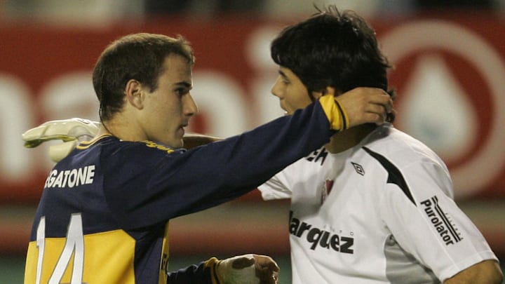 Rodrigo Palacio (L) of Boca Juniors, hug
